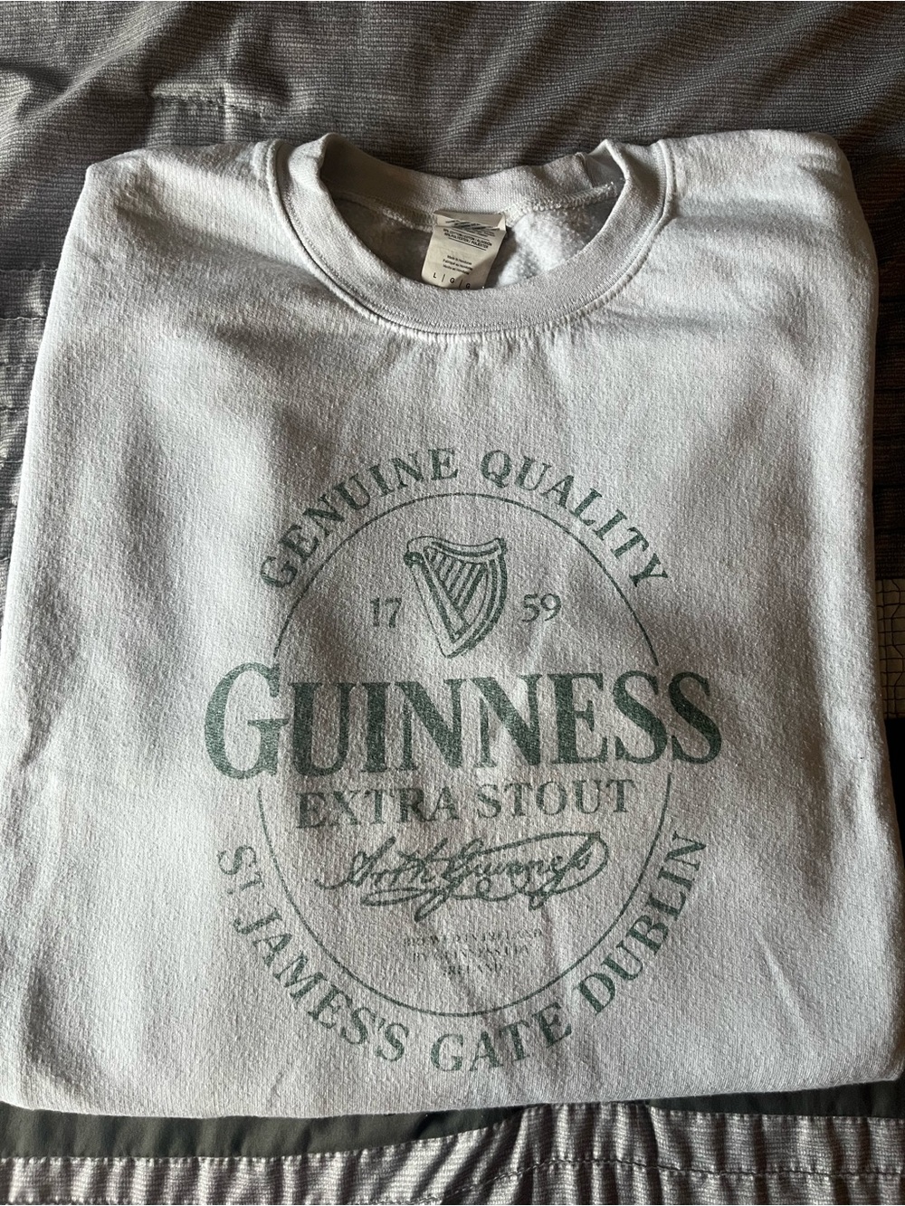 Faded White Guinness Crewneck Sweatshirt with Green Logo
